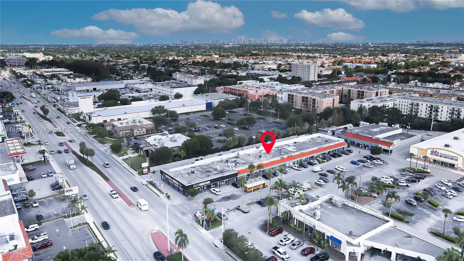 An aerial view shows a commercial strip mall with a parking lot and surrounding streets — 1428-1430 W 49th Street, Hialeah FL 33012, HIALEAH, FL