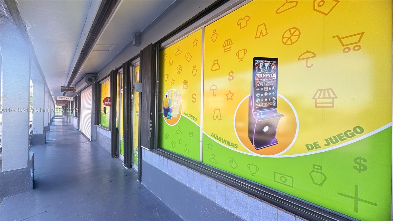A storefront exterior features large yellow and green window decals advertising gaming machines and supplies — 1428-1430 W 49th Street, Hialeah FL 33012, HIALEAH, FL