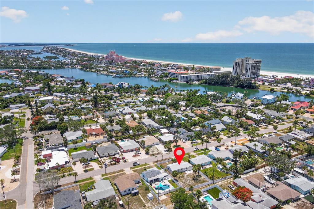 An aerial view shows a residential neighborhood near a beach with a red location marker — 260 42ND AVENUE, ST PETE BEACH, FL
