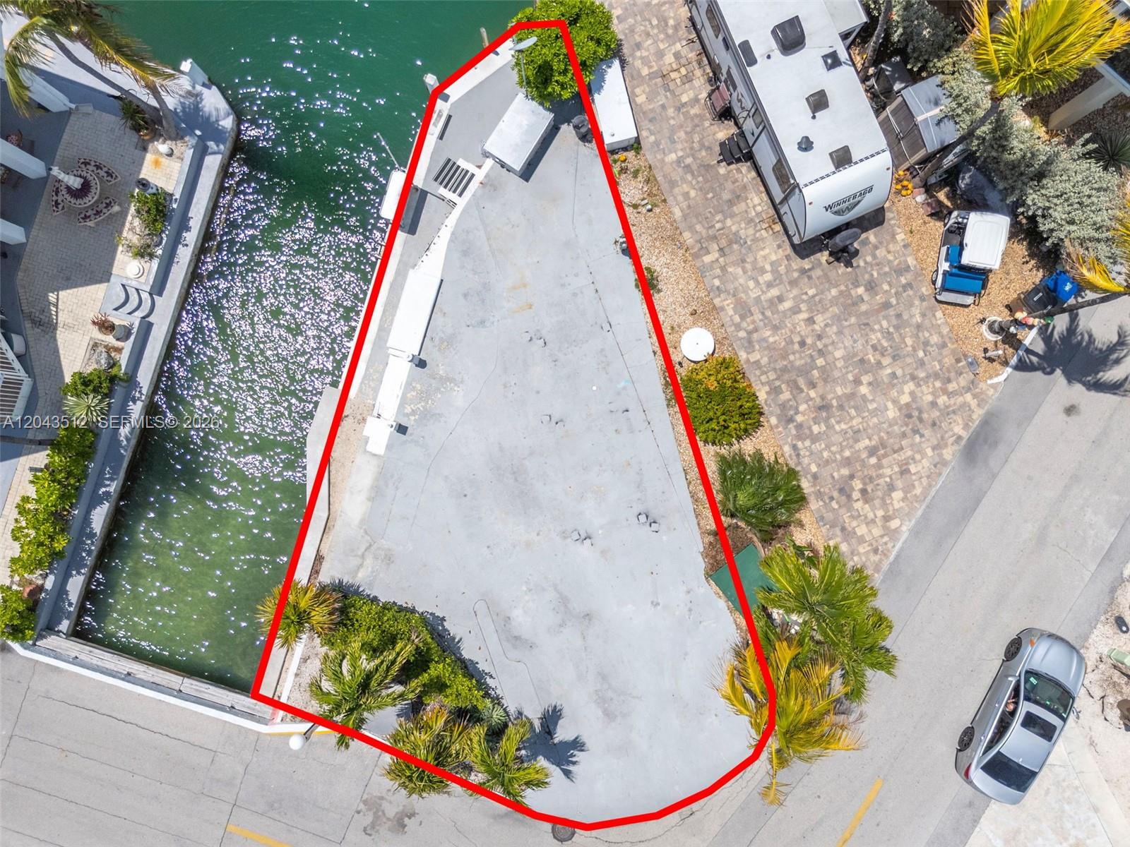 An aerial view shows a paved, triangular waterfront lot outlined in red — 65821 Overseas Hwy #291, Long Key FL 33001, LONG KEY, FL