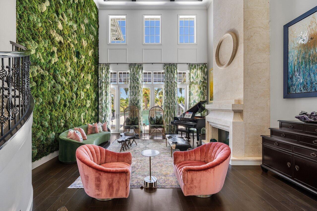 A living room features a large moss wall, a grand piano, and pink velvet chairs — 17837 Fieldbrook Circle W, Boca Raton FL 33496, BOCA RATON, FL