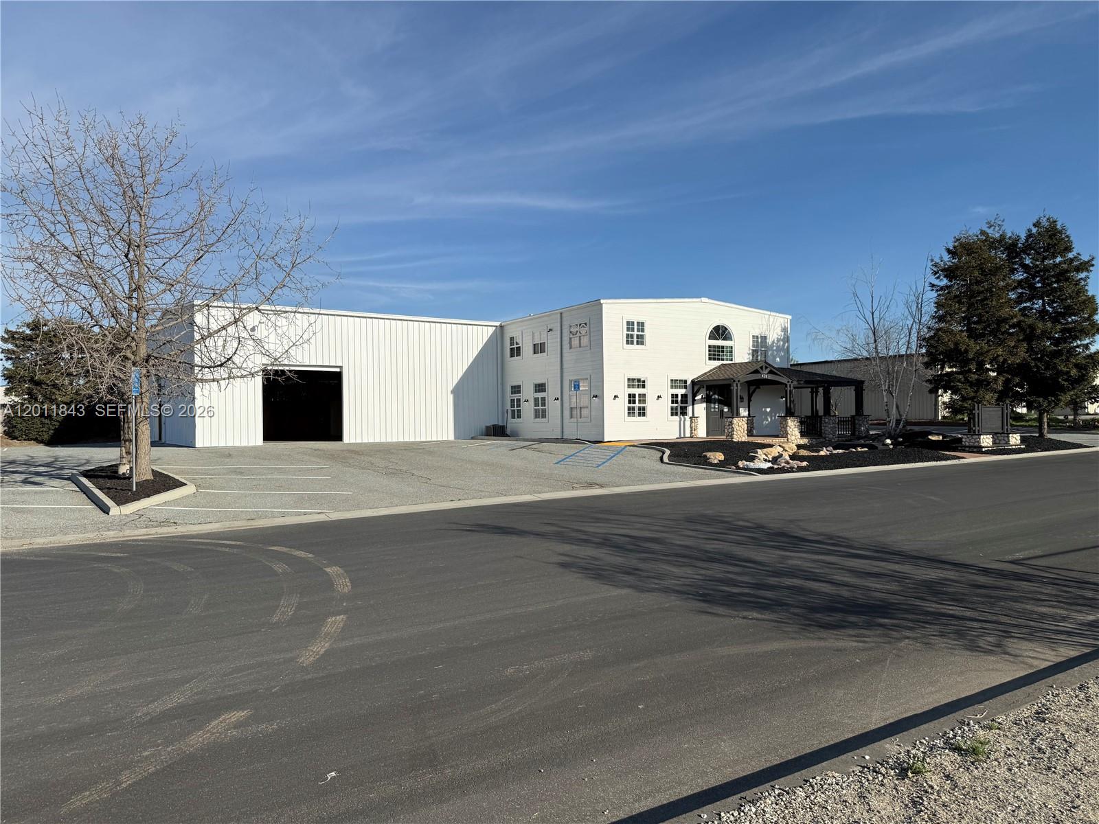 A white commercial building with a metal warehouse section and a two-story office area — 428 NORTH CURRY STREET # 0, CA 93561, CA
