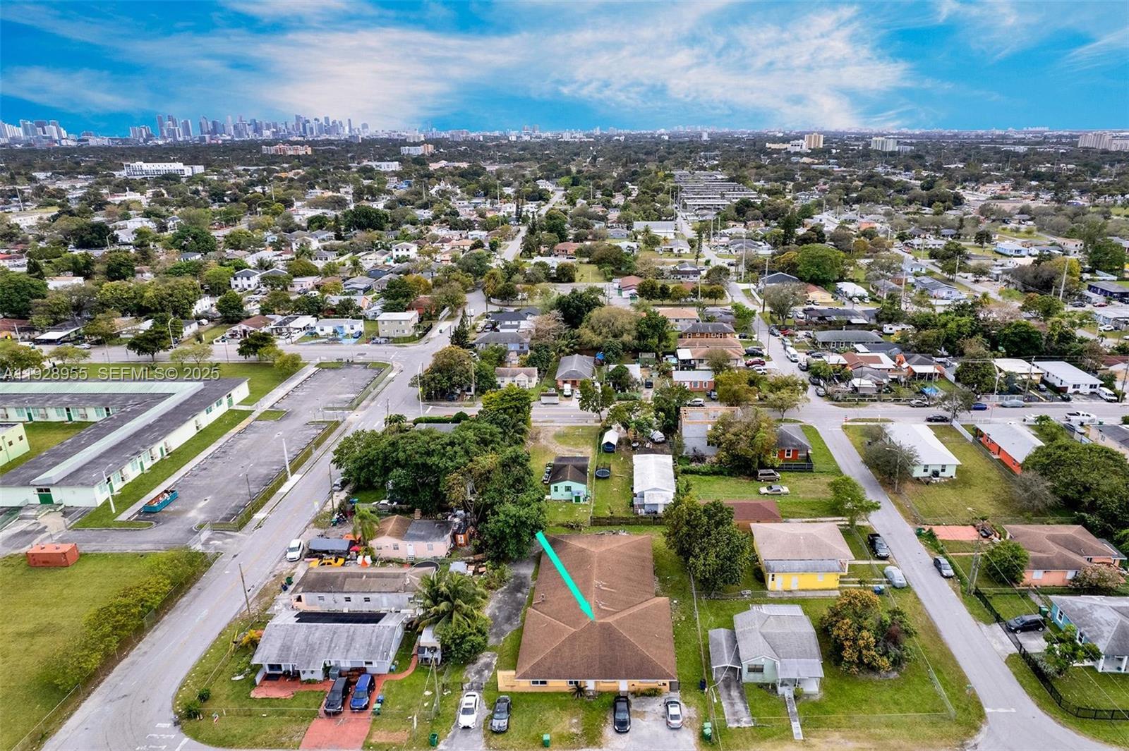 An aerial view shows a residential neighborhood with a highlighted single-story house and surrounding properties — 1910 NW 72nd St, Miami FL 33147, MIAMI, FL