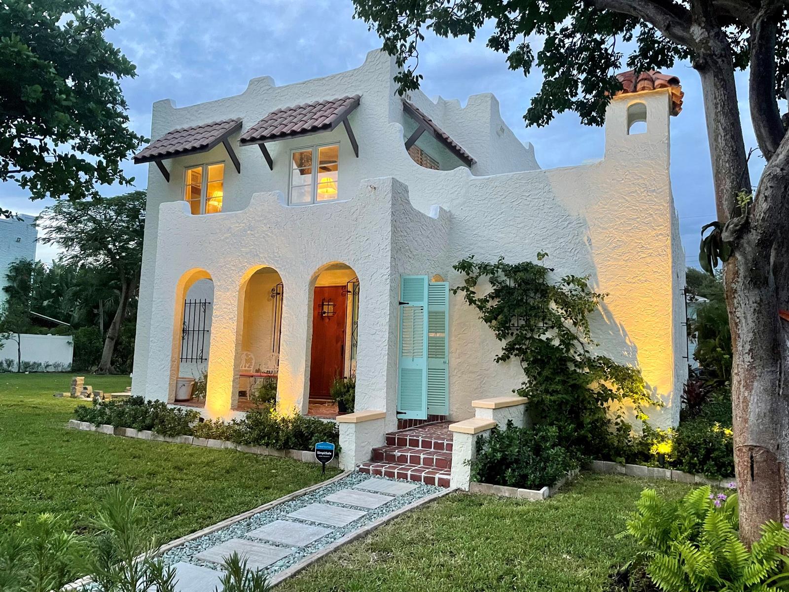A white stucco house with arched entryways, a tiled roof, and a front walkway — 302 Fordham Drive, FL 33460, FL