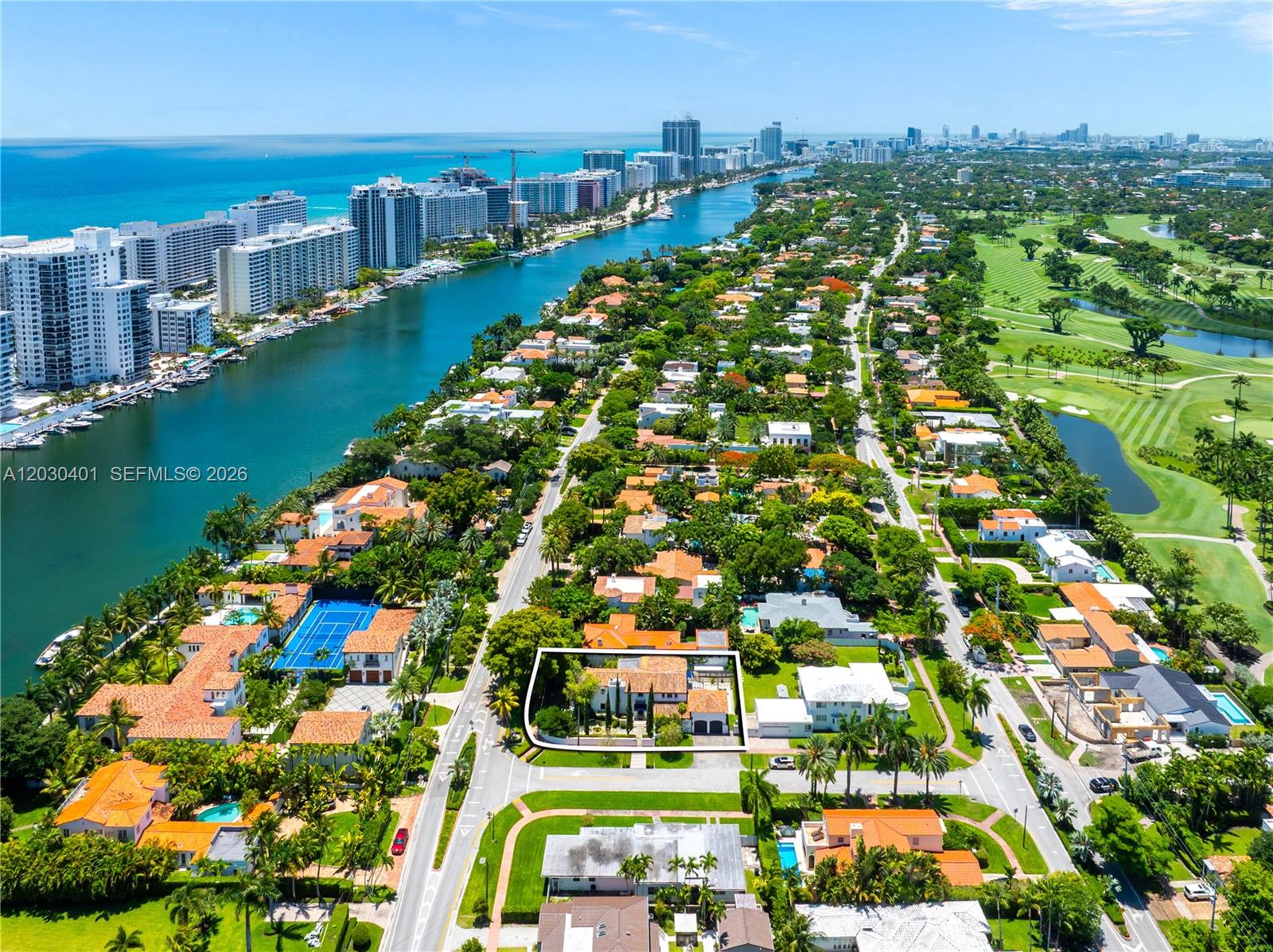 An aerial view shows a residential property outlined in white within a coastal neighborhood — 5860 Pine Tree Dr, Miami Beach FL 33140, MIAMI BEACH, FL