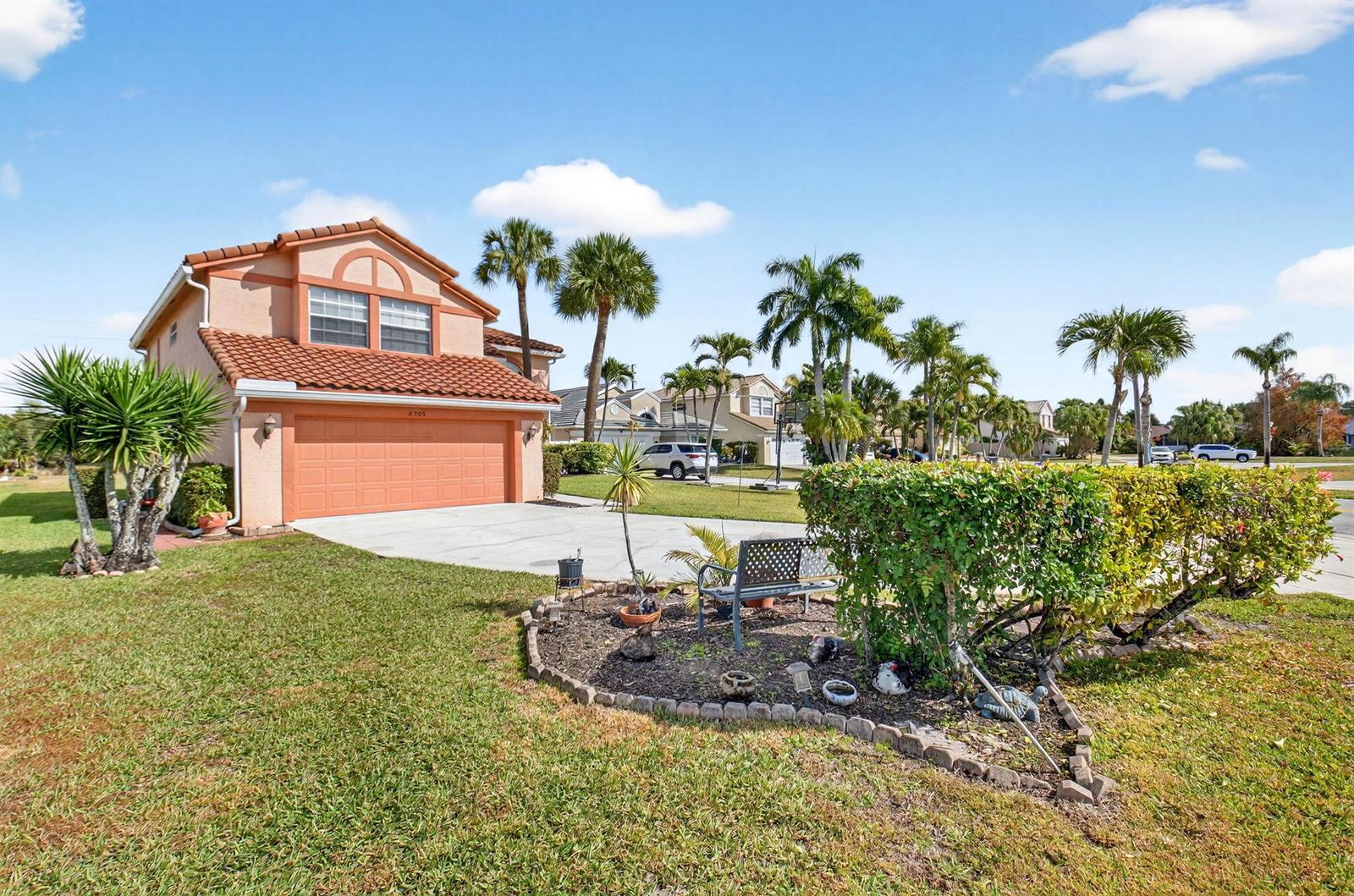 A two-story house with a terracotta tile roof and a front-facing garage — 6205 Balmy Court, Boynton Beach FL 33472, BOYNTON BEACH, FL