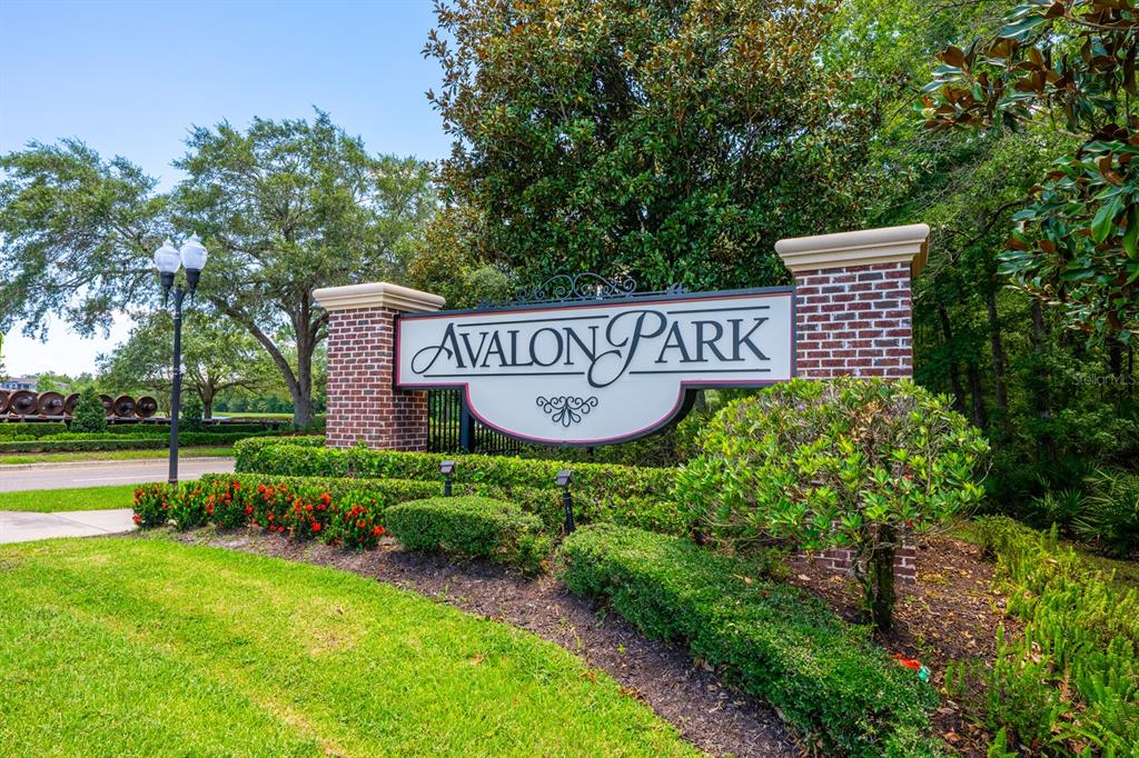 A brick monument sign for Avalon Park stands in a landscaped area with trees — 2564 ABEY BLANCO DRIVE, ORLANDO, FL