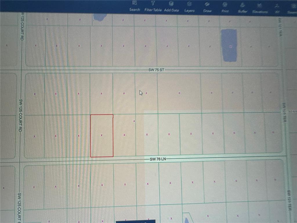 This is a digital map showing a highlighted rectangular land parcel between two streets — SW 76TH LANE, DUNNELLON, FL
