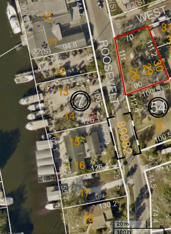 This is an aerial map showing property lot lines and parcel numbers for a residential area — W SPRUCE STREET, TARPON SPRINGS, FL