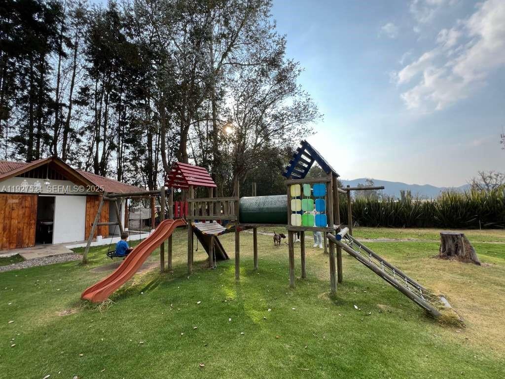 Outdoor children’s play area with supporting facilities nearby, offering ample space and a safe, open-air environment. — 0, 00000, FL