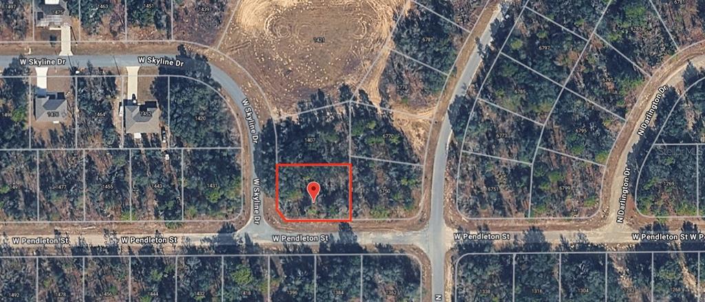 This is an aerial map showing a vacant, wooded residential lot outlined in red — 1389 W PENDLETON STREET, DUNNELLON, FL