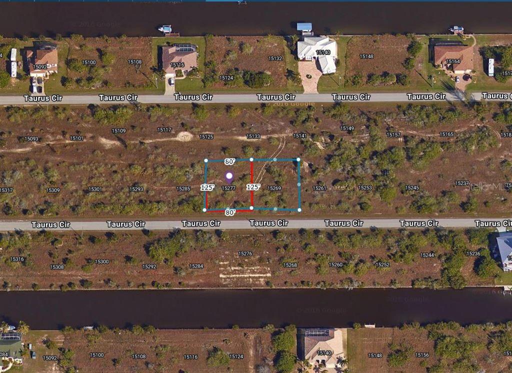 This is an aerial map showing a vacant rectangular lot highlighted on a residential street — 15277 TAURUS CIRCLE, PORT CHARLOTTE, FL