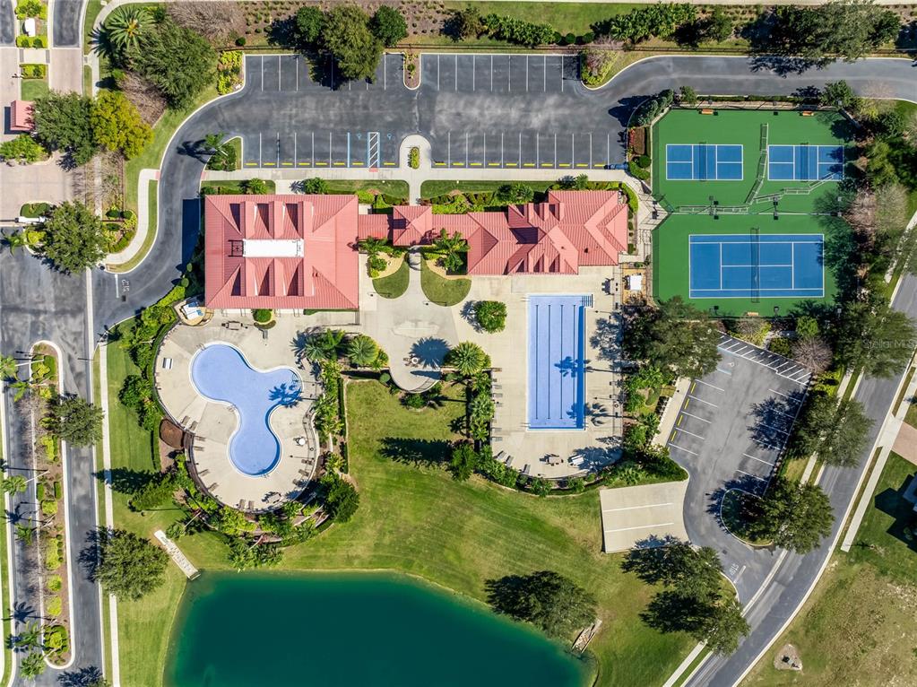 The entrance to the Waterridge community features a gatehouse, landscaping, and a stone monument sign — 535 ADAMS VIEW LANE, AUBURNDALE, FL