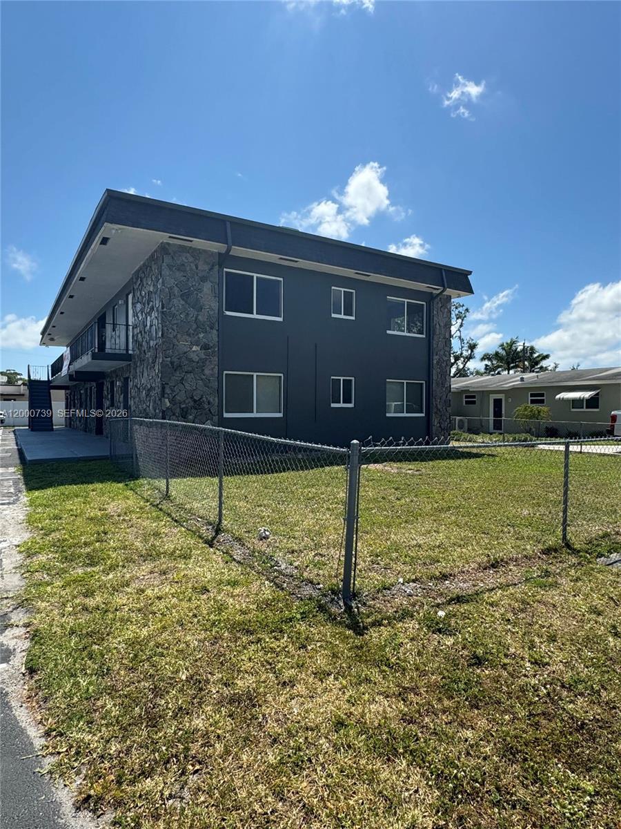 A two-story apartment building with stone siding and dark gray exterior walls — 4850 SW 26th Ave # 6, Dania Beach FL 33312, DANIA BEACH, FL