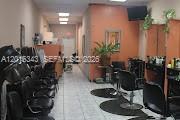 A narrow hair salon interior features rows of black styling chairs and tile flooring — 6647 Taft St, Hollywood FL 33024, HOLLYWOOD, FL