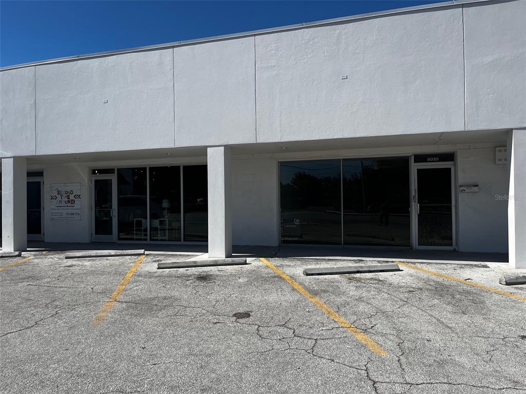 The exterior of a commercial building features two glass storefront entrances and a paved parking lot — 6020 SEMINOLE BOULEVARD, SEMINOLE, FL
