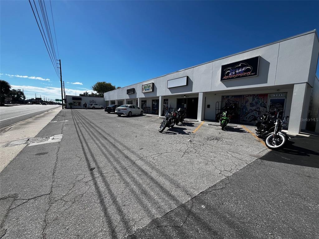 A commercial building exterior features a parking lot with several motorcycles parked in front — 6020 SEMINOLE BOULEVARD, SEMINOLE, FL