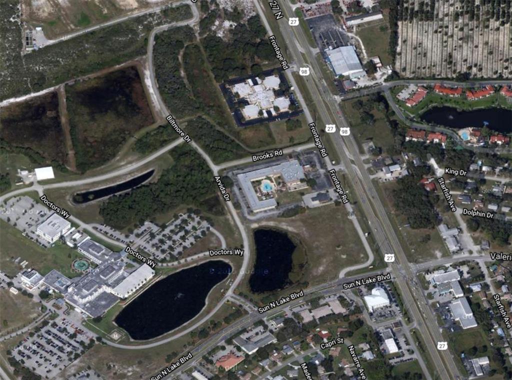 This is an aerial map view of a commercial area with roads and buildings — 6801 US 27 HIGHWAY N UNIT E-5, 6, & 7, SEBRING, FL