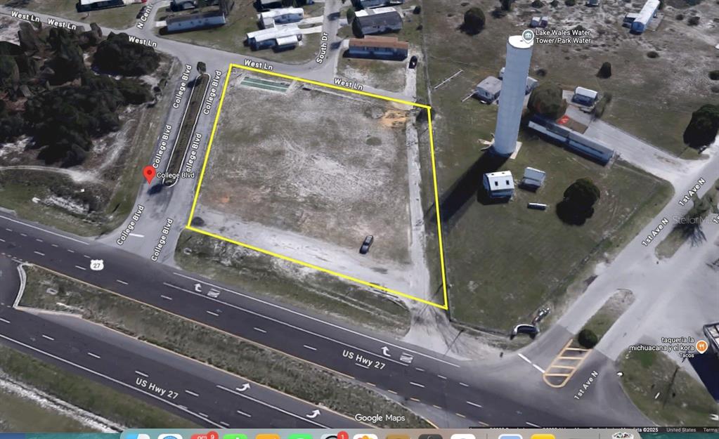An aerial view shows a vacant, rectangular lot outlined in yellow near a highway — US HIGHWAY 27 S, LAKE WALES, FL