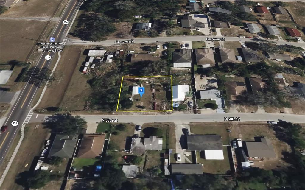 An aerial view shows a rectangular lot with a small structure outlined in yellow — 3817 N 58TH STREET, TAMPA, FL