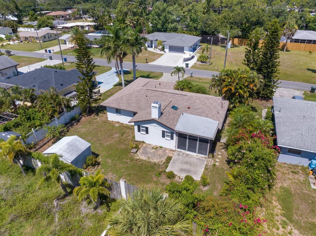 An aerial view of a single-story house with a backyard, patio, and detached shed — 1236 GAYLE AVE, NOKOMIS, FL