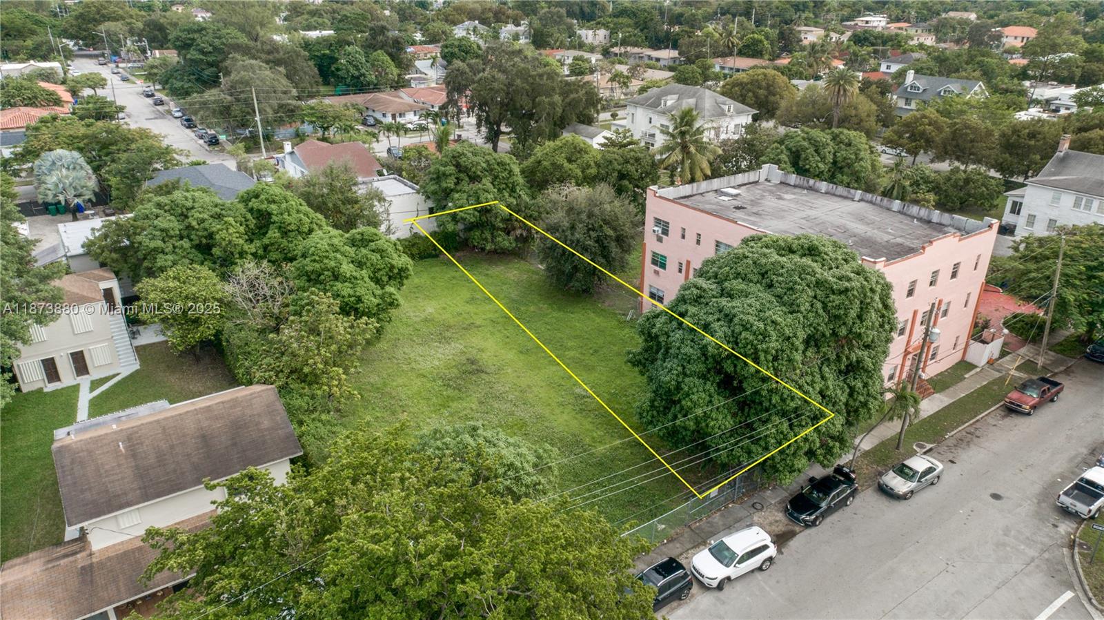 An aerial view shows a vacant, rectangular grassy lot situated between two residential buildings — 1001 SW 15th Ave, Miami FL 33135, MIAMI, FL