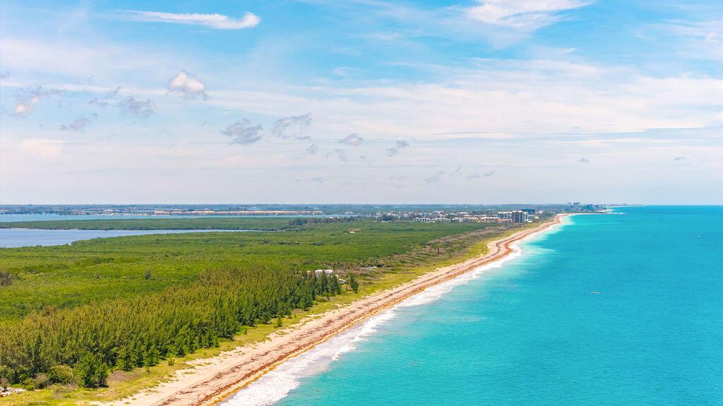 An aerial view shows a rectangular plot of land situated between a beach and road — 0 S Ocean Drive, Fort Pierce FL, FORT PIERCE, FL