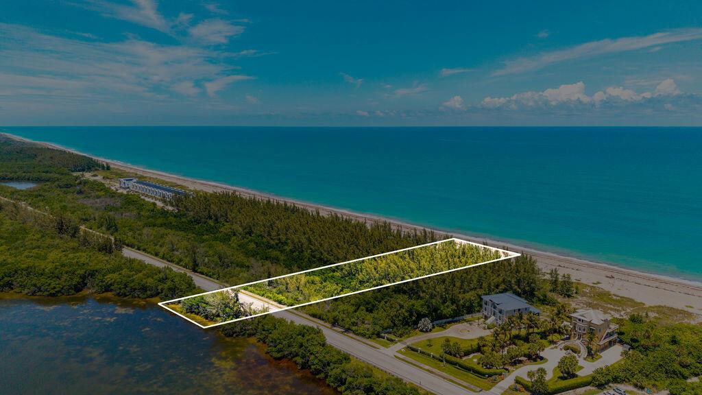 An aerial view shows a sandy beach bordering a dense forest and turquoise ocean water — 0 S Ocean Drive, Fort Pierce FL, FORT PIERCE, FL
