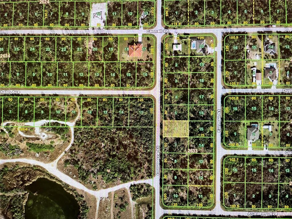 This is a satellite map showing residential land plots and streets in a wooded area — 1270 COMMERCE STREET, PORT CHARLOTTE, FL