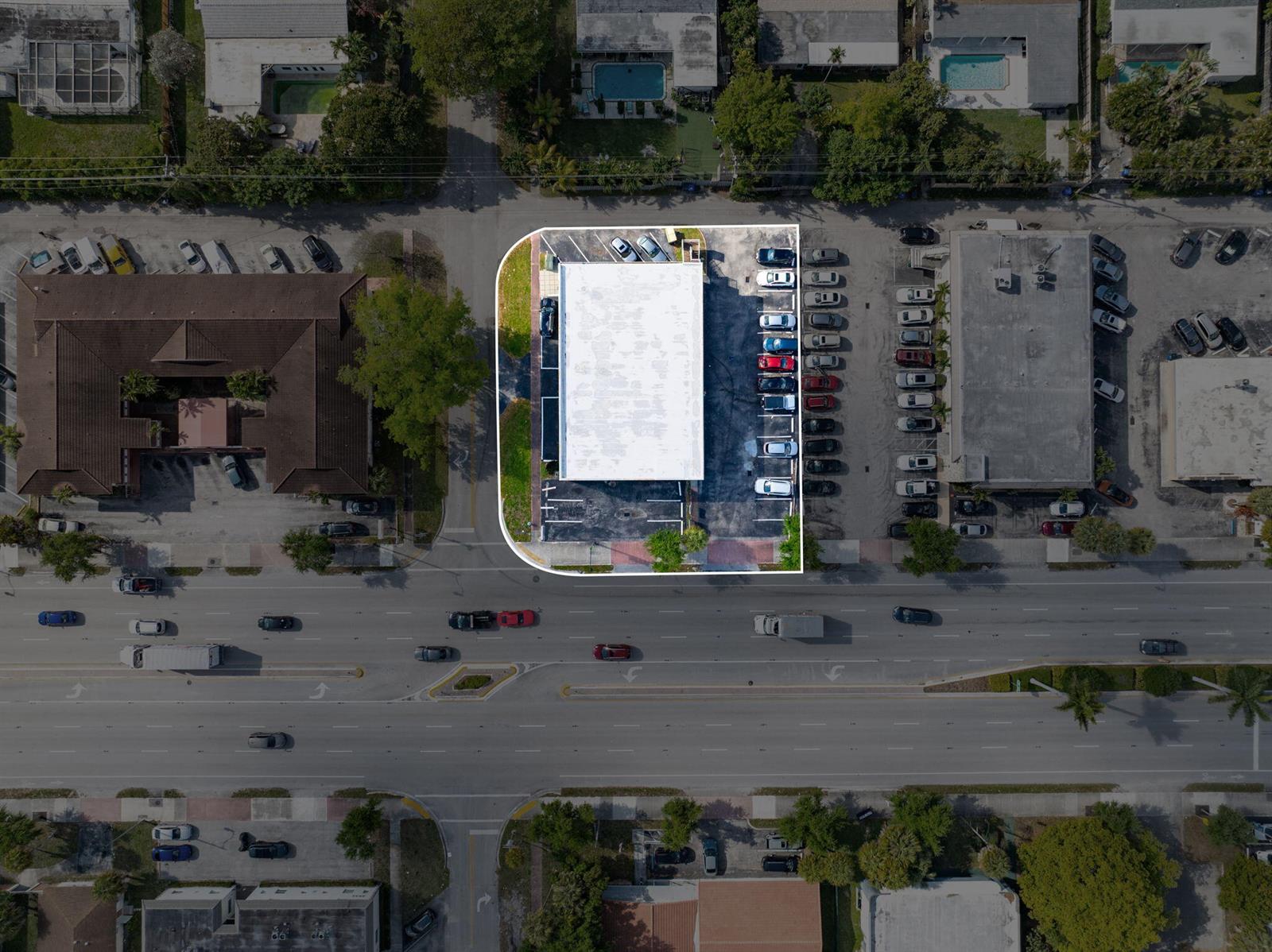 An aerial view shows a commercial building with a parking lot outlined in white — 5000 Hollywood Boulevard, Hollywood FL 33021, HOLLYWOOD, FL