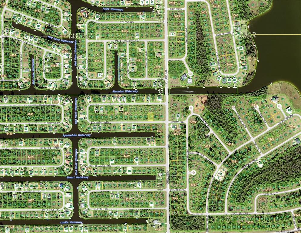 This is an aerial map showing a residential neighborhood with streets, waterways, and vacant lots — 15787 STAUNTON CIRCLE, PORT CHARLOTTE, FL