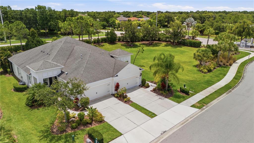 An aerial view shows a single-story house with a multi-car garage and large lawn — 4504 DEEP CREEK TERRACE, PARRISH, FL