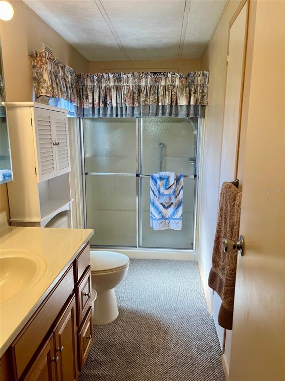 A community room features rows of folding tables and chairs under a drop ceiling — 5013 FOXWOOD BOULEVARD, LAKELAND, FL