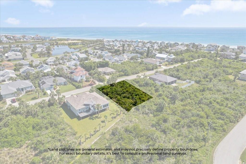 An aerial view shows a rectangular vacant lot highlighted in green next to a house — 16 MAHOE DRIVE N, PALM COAST, FL