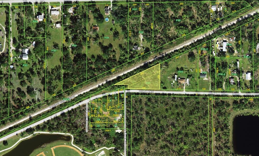 This is an aerial map showing property parcel boundaries, roads, and a railroad track — 25290 DUNDEE ROAD, PUNTA GORDA, FL