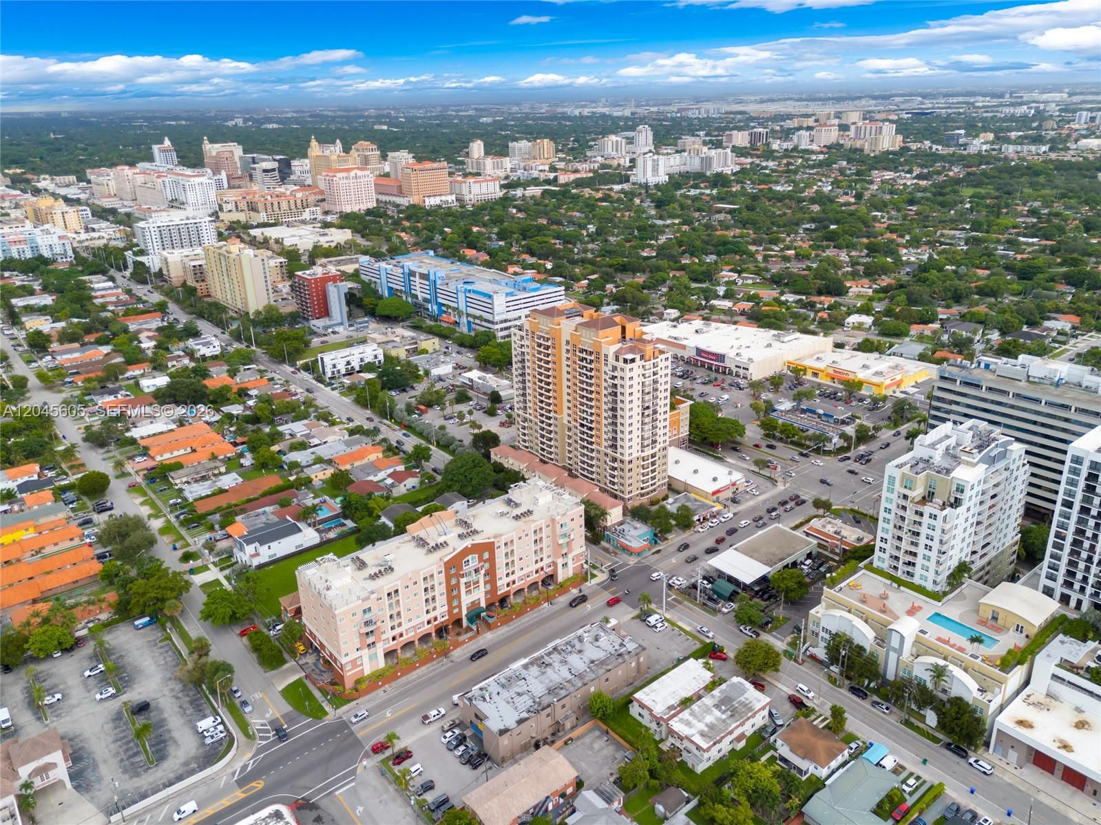 An aerial view shows a dense urban neighborhood with apartment buildings, parking lots, and streets — 3232 SW 22nd Ter # 804, Miami FL 33145, MIAMI, FL