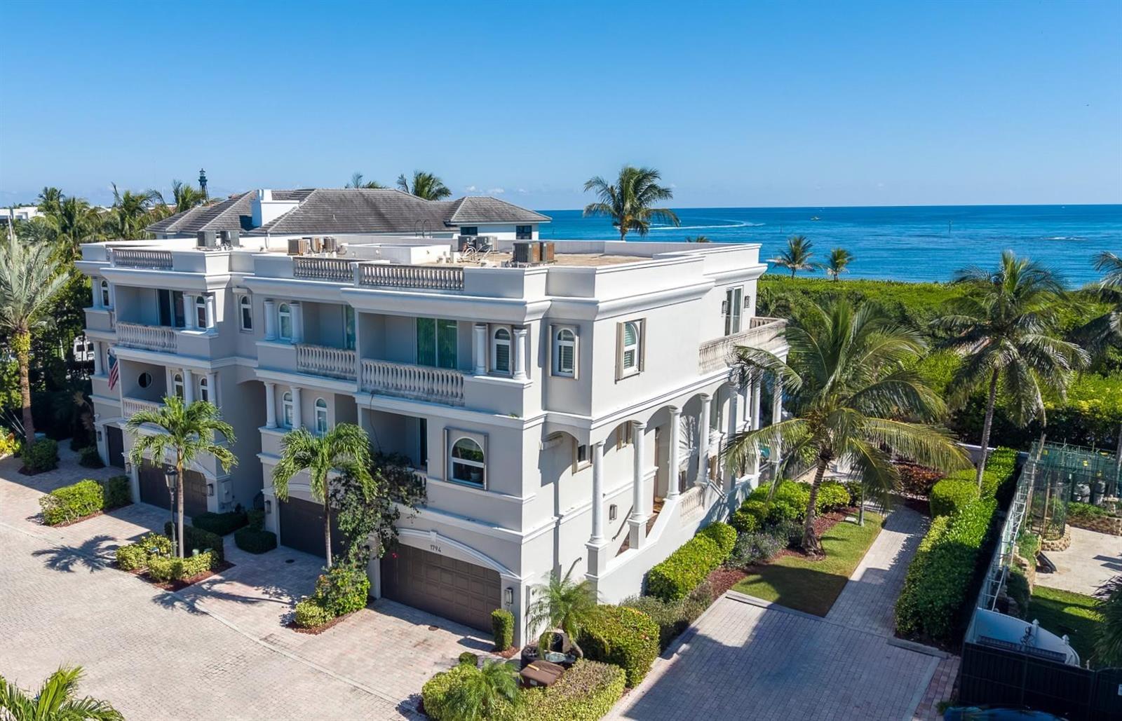 An exterior view of a multi-story white villa with a flat roof and ocean views — 1796 Bay Drive # 1796, Pompano Beach FL 33062, POMPANO BEACH, FL