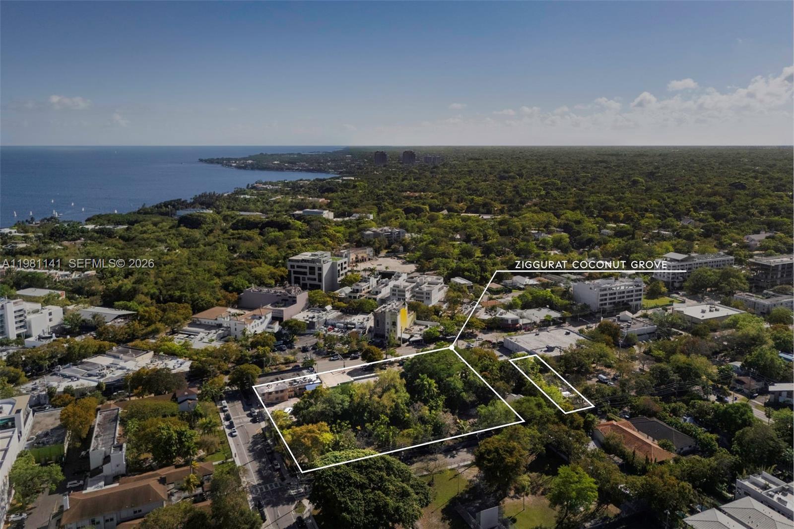 An aerial view shows a vacant, tree-filled lot outlined in white within a coastal neighborhood — 3170 Florida Ave, Miami FL 33133, MIAMI, FL