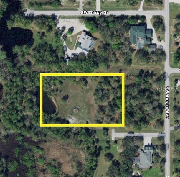 An aerial map shows a rectangular plot of land outlined in yellow near a road — 11972 SW CHRISTIANA PLACE, ARCADIA, FL