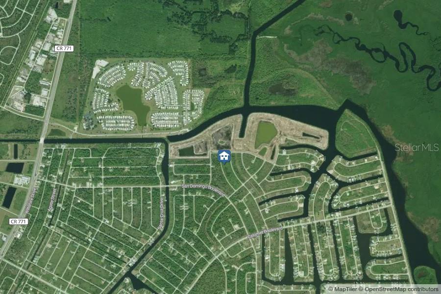 This is an aerial map view showing a residential neighborhood with canals and surrounding wetlands — 8070 THRUSO ROAD, PORT CHARLOTTE, FL