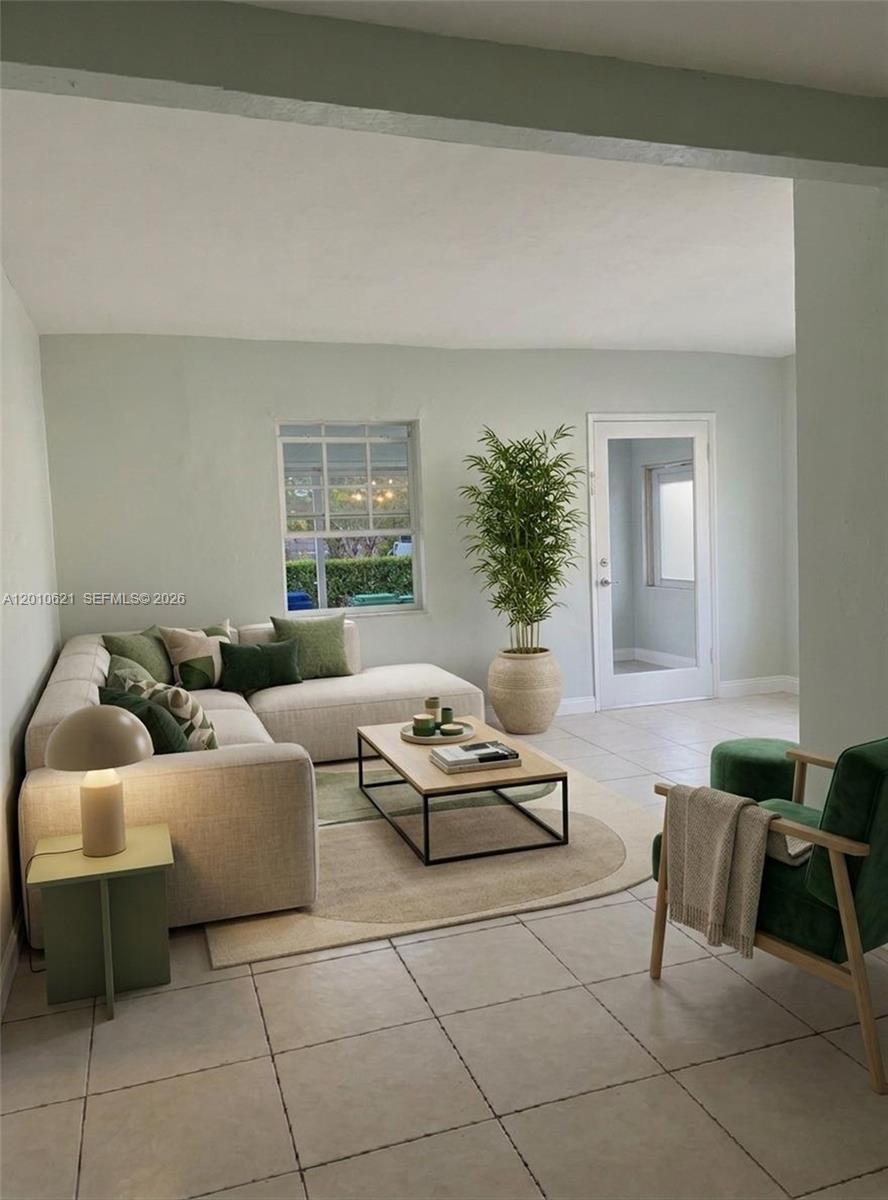 A living room features a beige sectional sofa, a coffee table, and green accent furniture — 2412 SW 11th St # 1, Miami FL 33135, MIAMI, FL