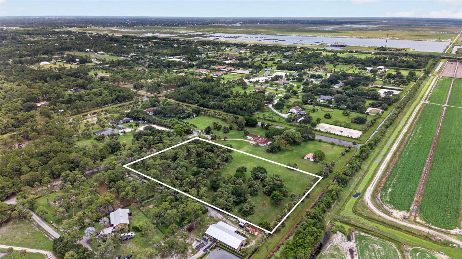An aerial view shows a rectangular property outlined in white amidst a rural landscape — 000 Foxtrail, Loxahatchee FL 33470, LOXAHATCHEE, FL
