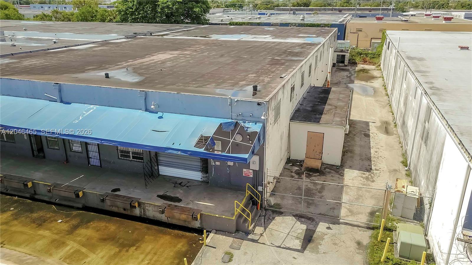 An aerial view shows the exterior of a commercial warehouse with a loading dock — 540 W 20th St, Hialeah FL 33010, HIALEAH, FL