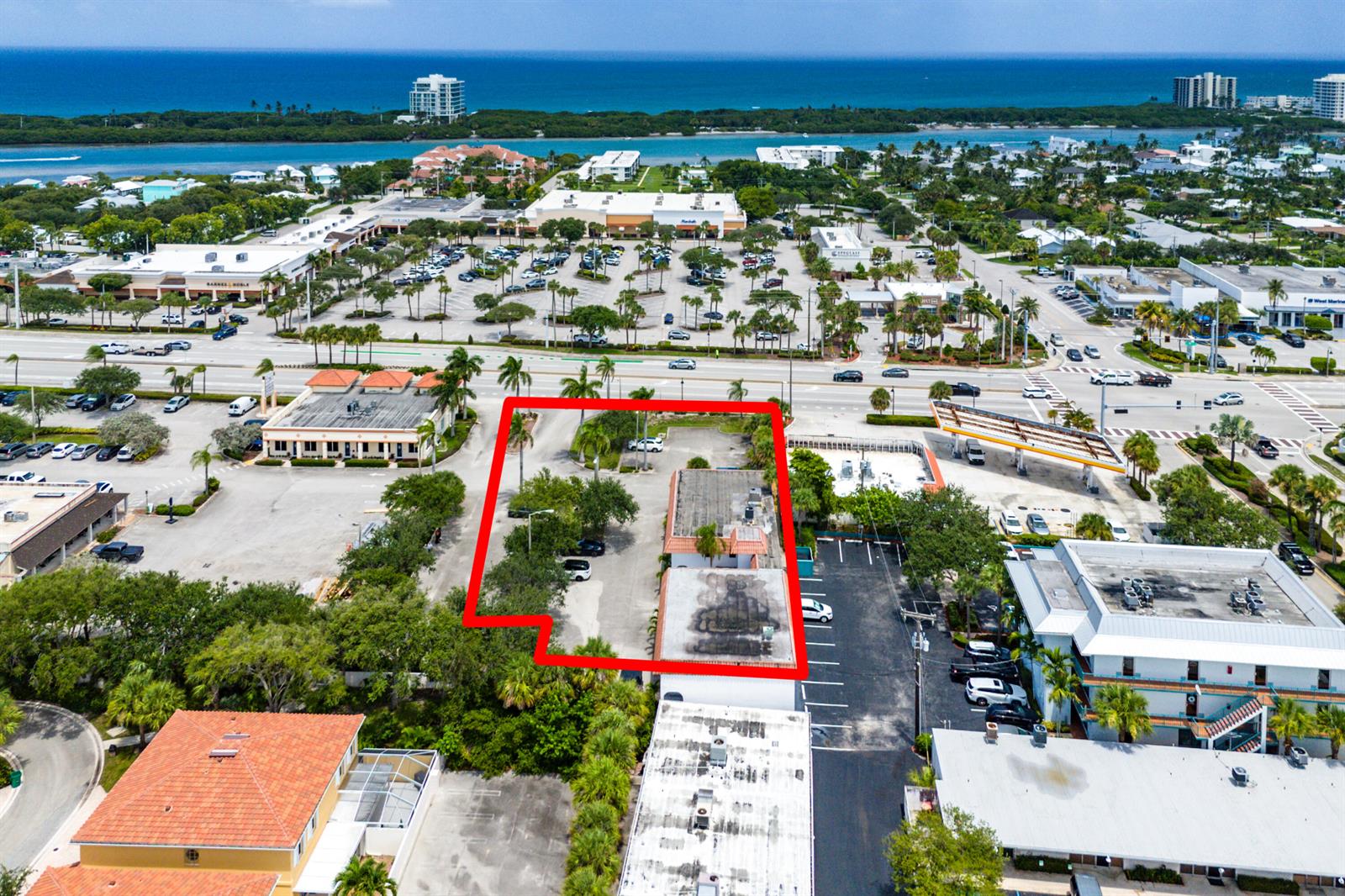 An aerial view shows a commercial property outlined in red, surrounded by parking and trees — 112 N Us Highway 1, Tequesta FL 33469, TEQUESTA, FL