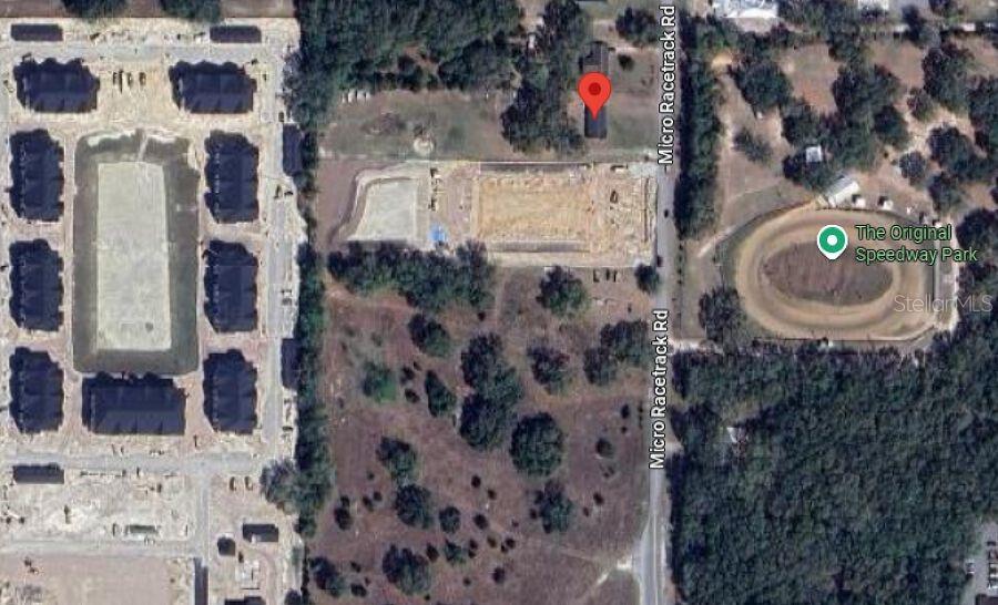This aerial map shows a residential property location near a racetrack and new construction — 35433 MICRO RACETRACK ROAD, FRUITLAND PARK, FL