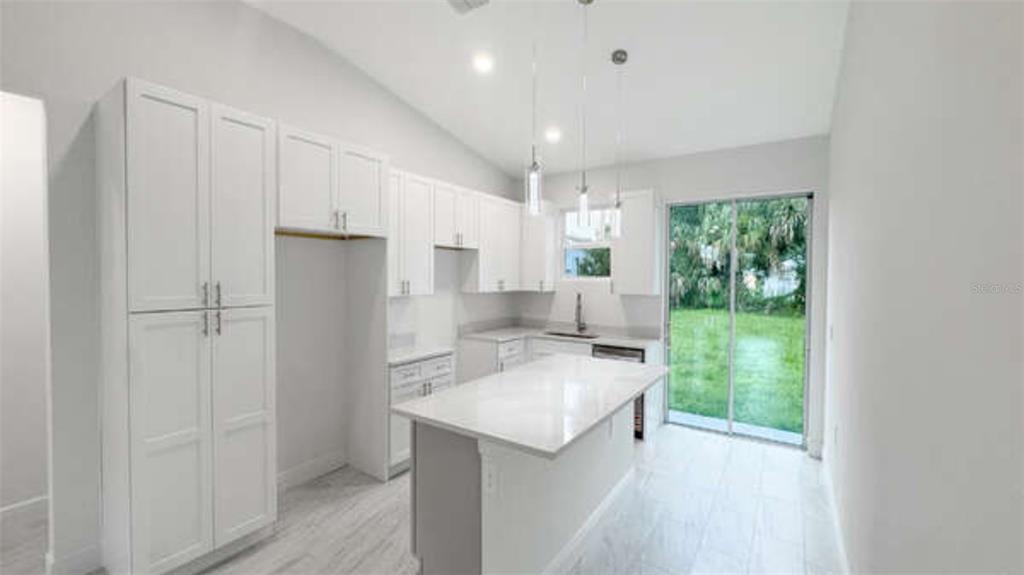 A bedroom features a bed with olive green accents, dark wood furniture, and a large mirror — 3620 WASHINGTON STREET, SANFORD, FL