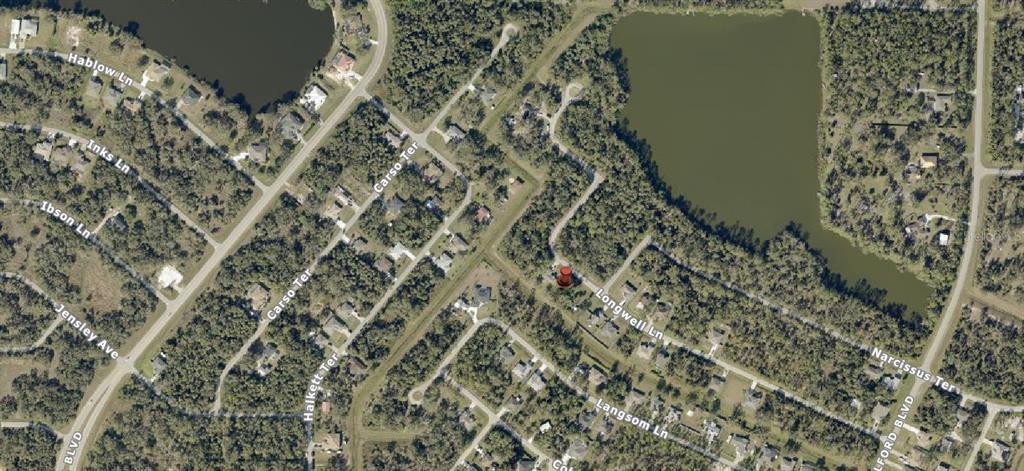 This is an aerial map view of a residential neighborhood with a red location pin — Lot 18 LONGWELL LANE, NORTH PORT, FL