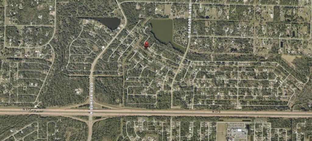 This is an aerial map showing a residential neighborhood near a highway and a lake — Lot 18 LONGWELL LANE, NORTH PORT, FL