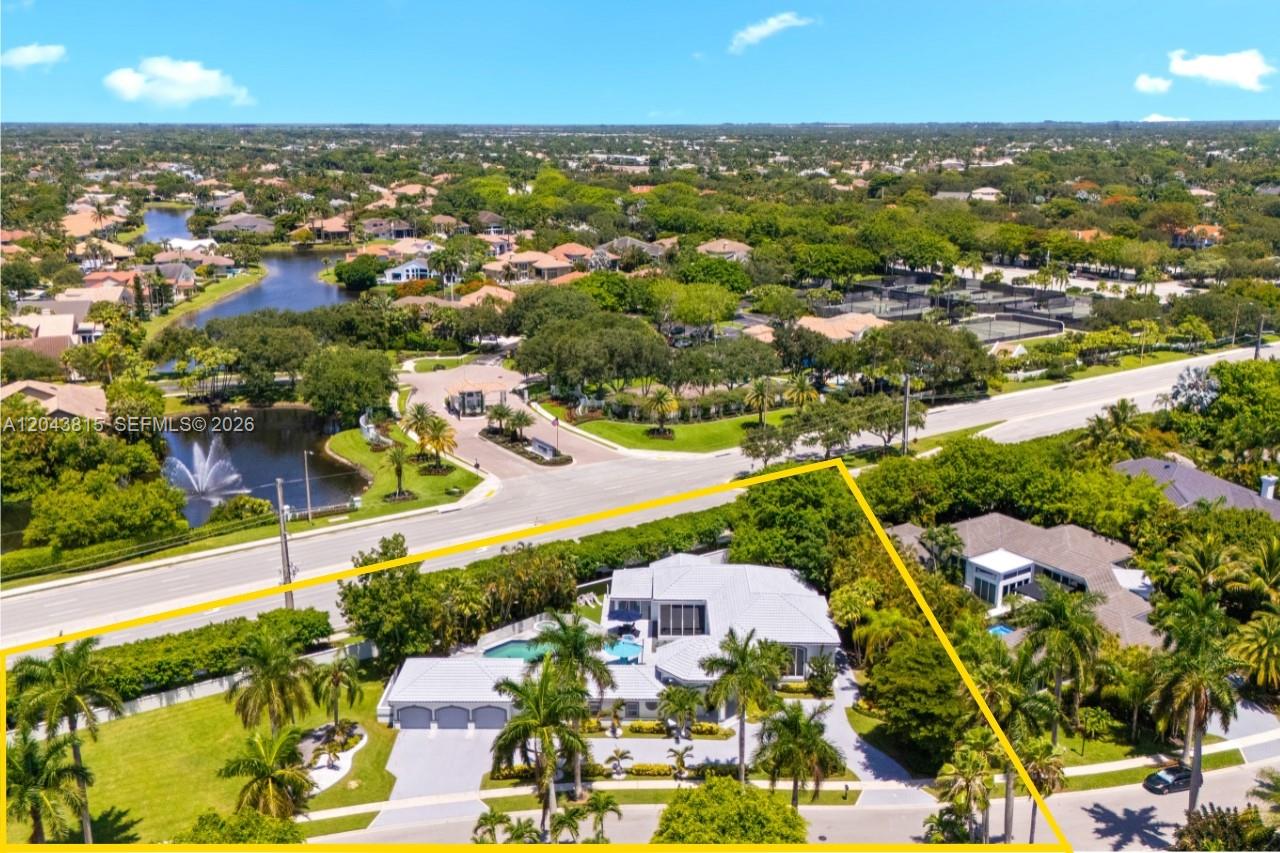 An aerial view shows a single-family home with a pool, driveway, and surrounding landscaping — 2673 NW 64th Blvd, Boca Raton FL 33496, BOCA RATON, FL