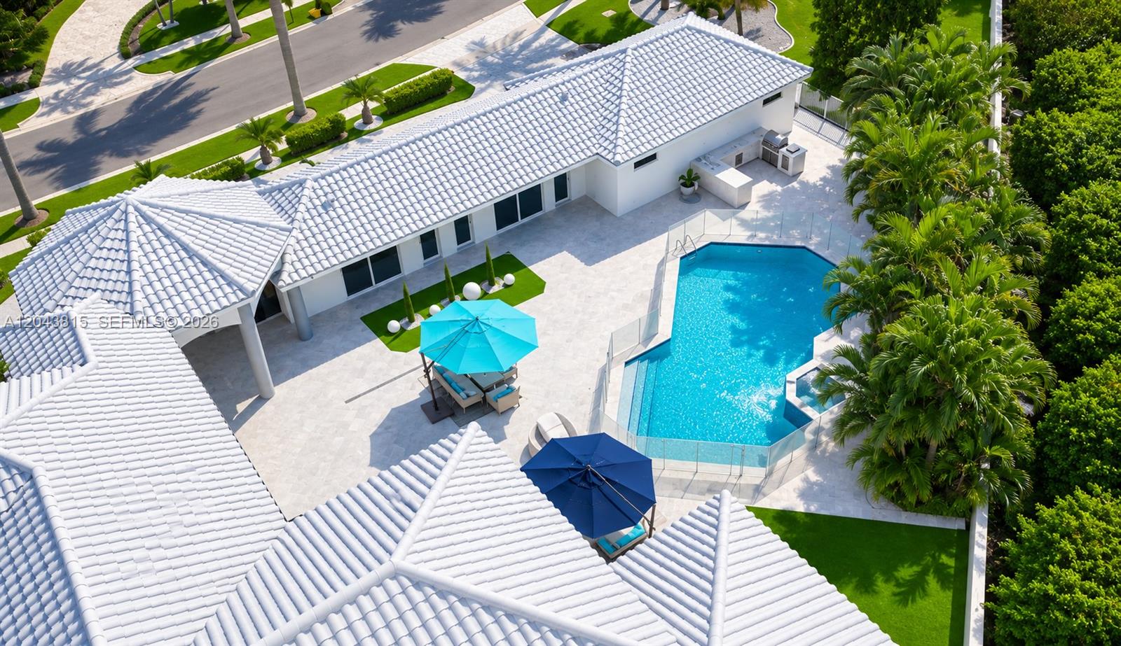 An aerial view shows a house with a white tile roof, pool, and patio area — 2673 NW 64th Blvd, Boca Raton FL 33496, BOCA RATON, FL
